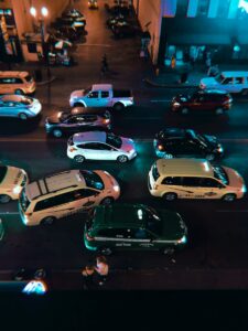 white car park beside store during night time